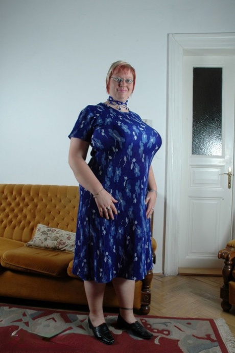 Short haired woman Diana unleashing her giant tits and exposing her fat body