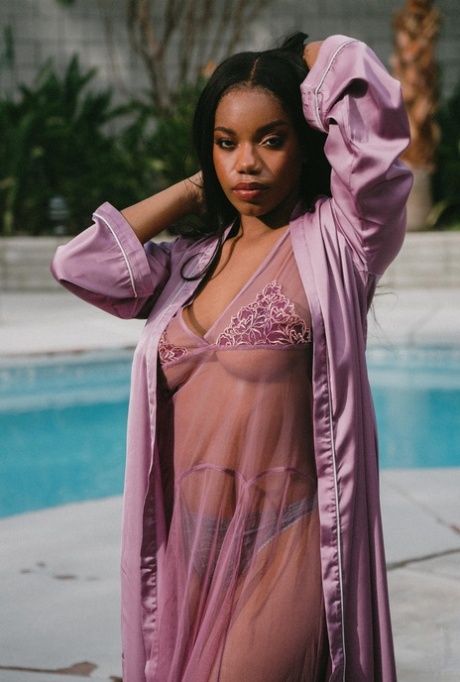 Beautiful black babe Selene teases with her big boobs while naked outdoors