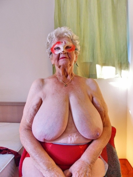 Short-haired granny Medora goes topless and shows her huge saggy tits