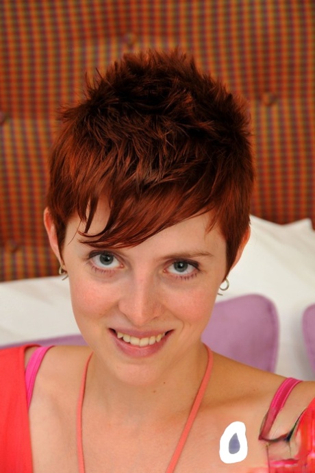 Short haired babe with huge boobs RyAnne displays her ginger bush